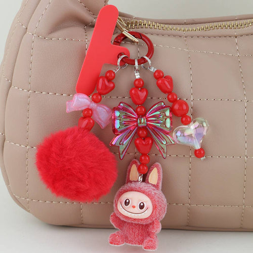 This is a Multi Ribbon Doll Beaded Bag Charm: YL | WILD FLIER GIFTS AND APPAREL