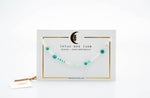 Lotus and Luna Evil Eye Necklaces